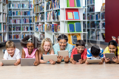 Teacher with students using digital tablet