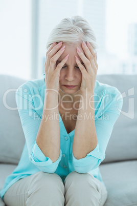 Senior woman suffering from headache