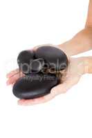 Cropped image of woman hands holding pebbles