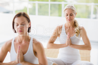 Women performing yoga