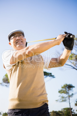 Low angle view of sportsman playing golf