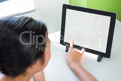 High angle view of girl using digital tablet