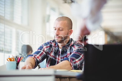 Young businessman working at desk