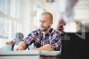 Young businessman working at desk