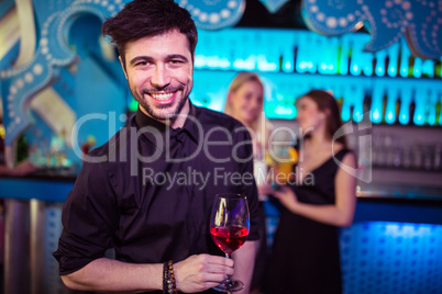 Portrait of smiling man in nightclub