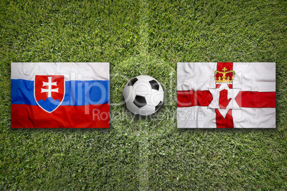 Slovakia vs. Northern Ireland flags on soccer field