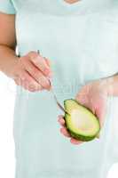 Woman holding avocado