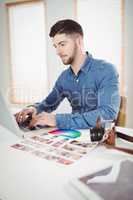 Confident man working at office