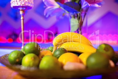Fruits in plate on bar counter
