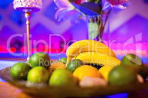 Fruits in plate on bar counter