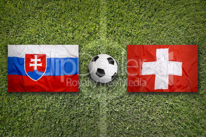 Slovakia vs. Switzerland flags on soccer field