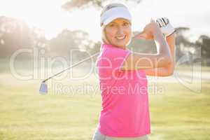 Portrait of woman golfer smiling