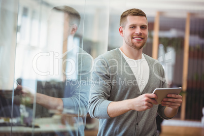 Businessman holding digital tablet in office