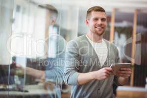 Businessman holding digital tablet in office