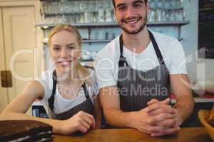 Portrait of happy colleagues at cafe