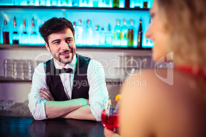 Bartender looking at woman in nightclub Bartender looking at woman in nightclub