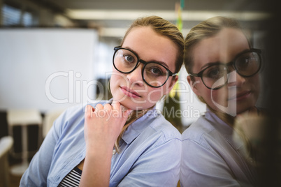 Businesswoman leaning on glass Businesswoman leaning on glass