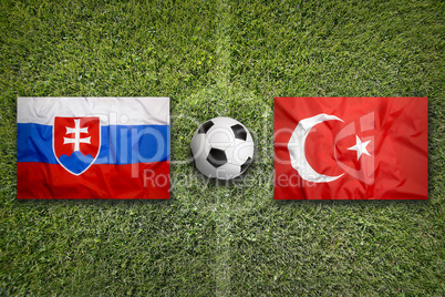 Slovakia vs. Turkey flags on soccer field