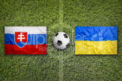 Slovakia vs. Ukraine flags on soccer field