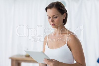 Young woman using digital tablet