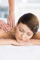 Relaxed woman enjoying massage