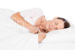 Side view of woman sleeping on bed