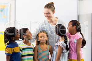 Teacher with schoolchildren in classroom