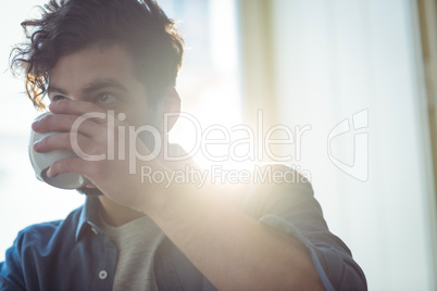 Man drinking coffee at cafe