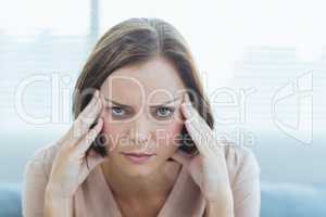 Portrait of woman suffering headache