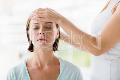 Woman receiving massage from masseur