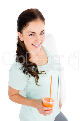 Portrait of smiling woman holding juice