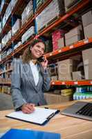 Business woman calling on her desk