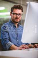 Portrait of confident businessman working at office