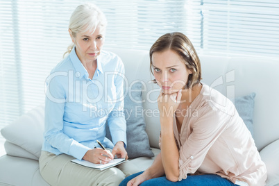 Portrait of woman with therapist