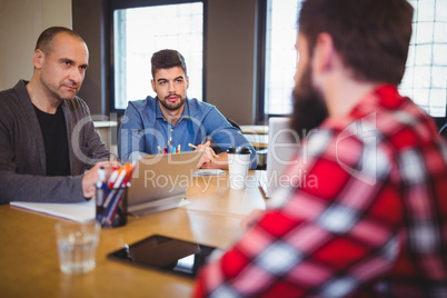 Business people discussing at desk