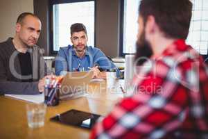 Business people discussing at desk