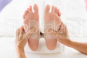 Cropped image of woman receiving foot massage