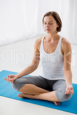 Full length of woman performing yoga