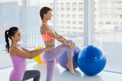 Side view of trainer working with young woman