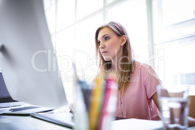 Attractive graphic designer working on computer