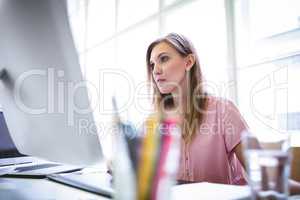 Attractive graphic designer working on computer