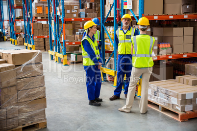 Workers speaking together