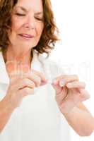 Mature woman holding medicine