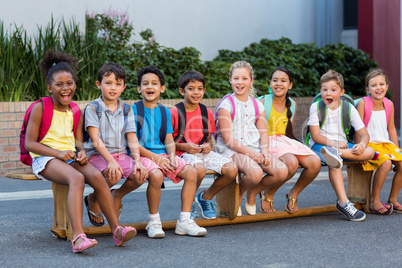 Smiling schoolchildren on seat