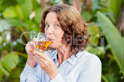Portrait of mature woman drinking herbal tea
