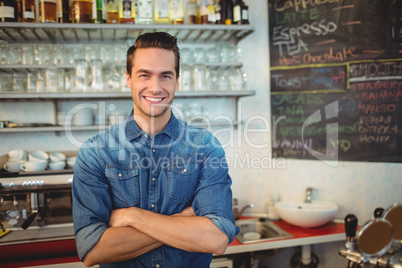 Portrait of handsome cafe owner