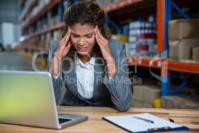 Business woman is stressed because of work
