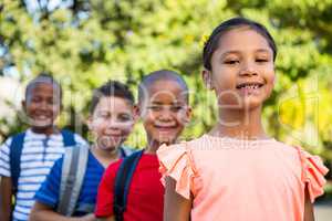 Friends standing in queue at campus