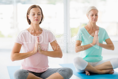 Women performing yoga