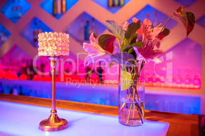 Flower vase and decor on bar counter